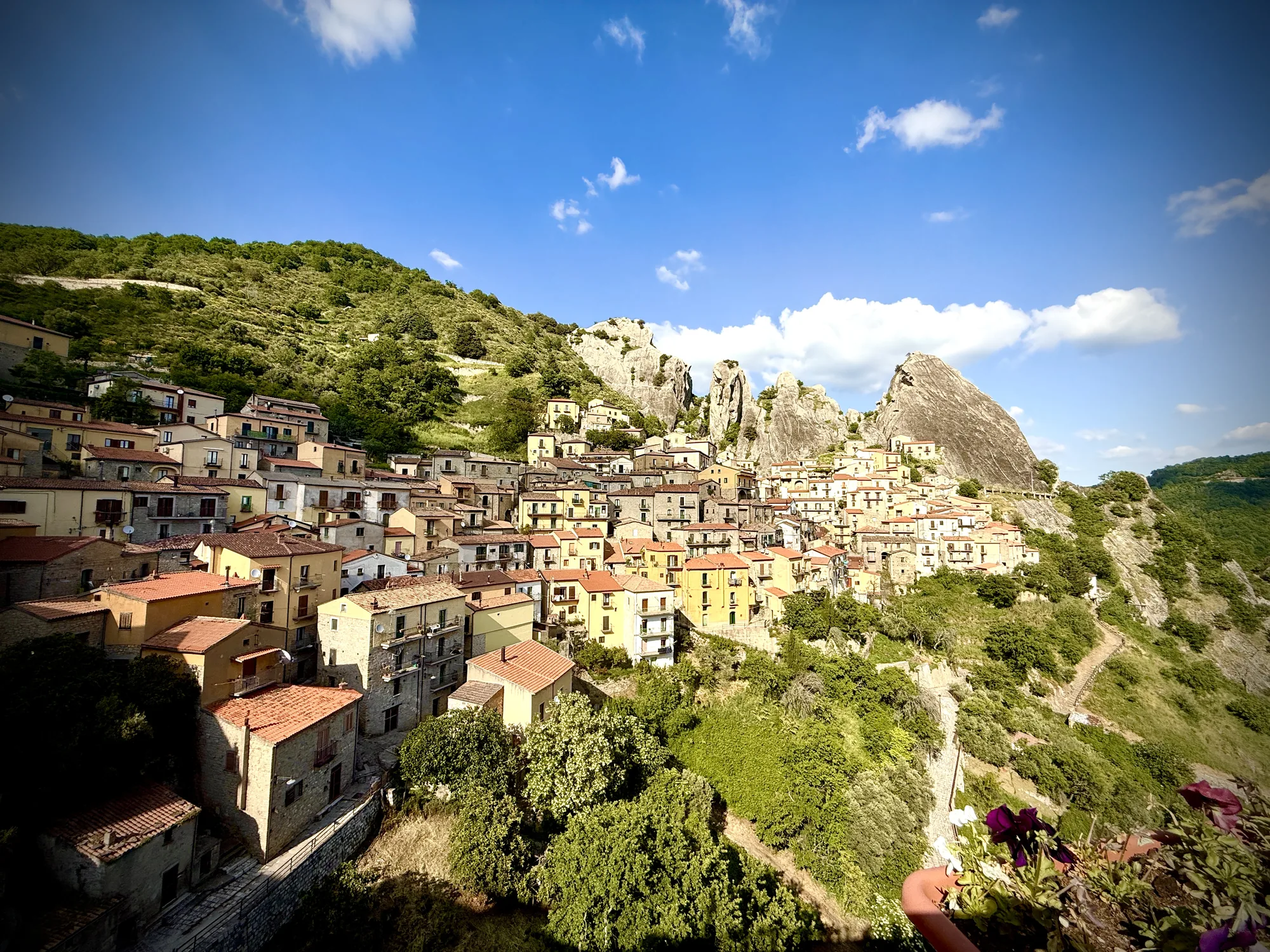 Castelmezzano village clinging to the Dolomiti Lucane limestone pinnacles, Basilicata Italy