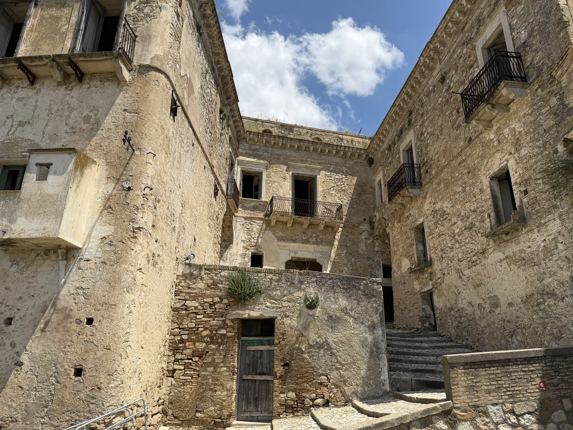 Craco abandoned palazzo courtyard open to sky, Basilicata ghost town