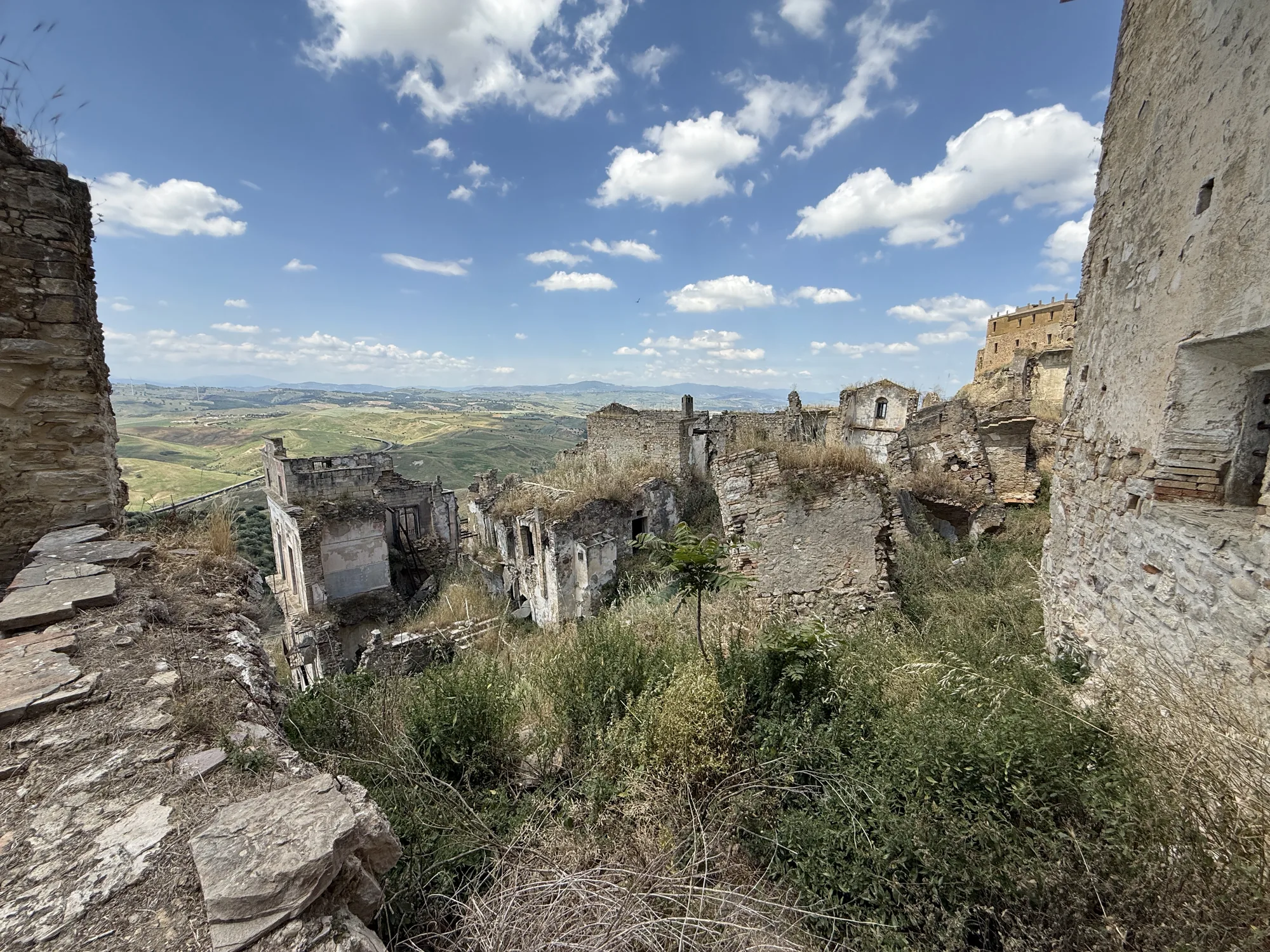 Craco abandoned village ruins spreading across the hillside, Basilicata Italy